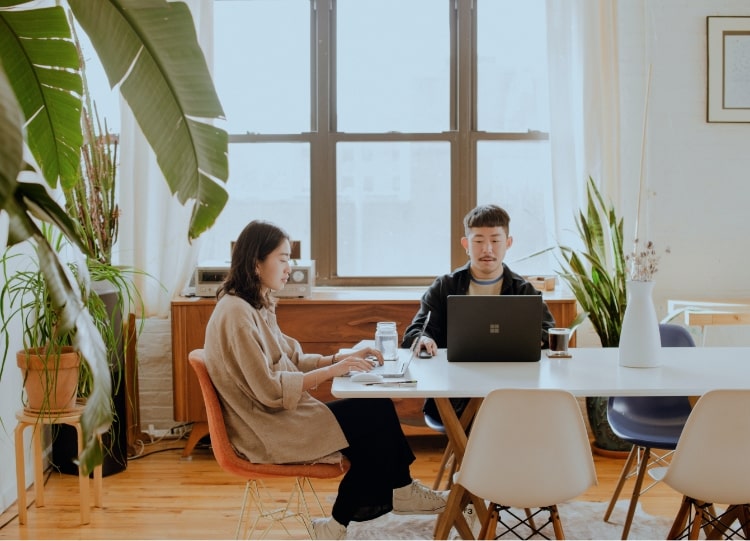 Two creatives working at Reside