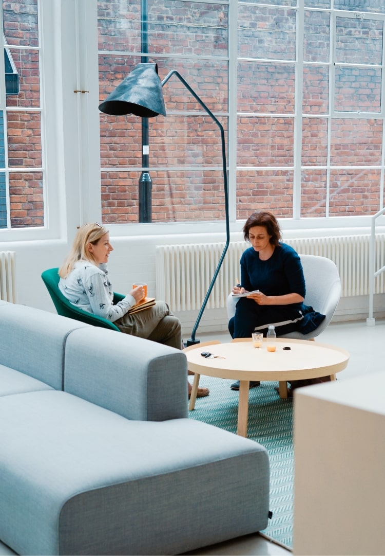 Two people working at Reside